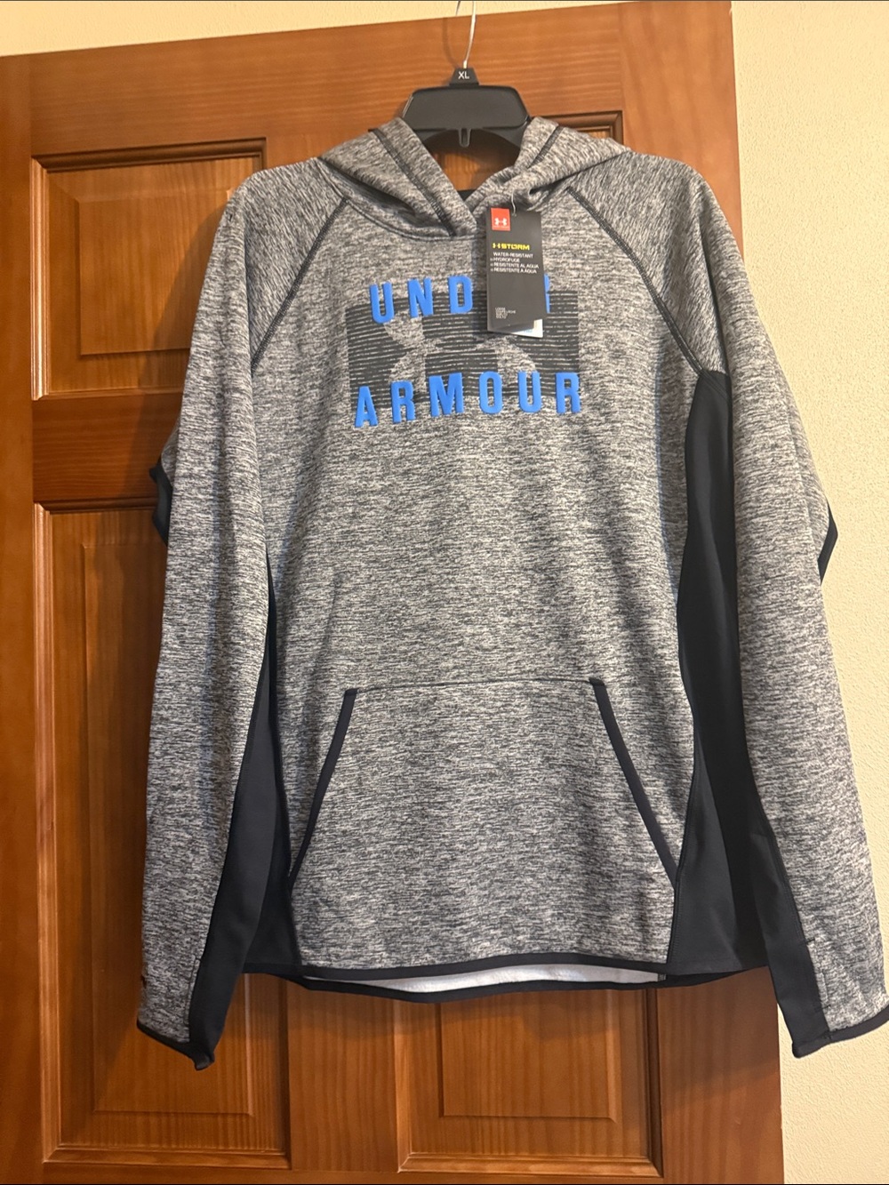 Under Armour Gray and Navy Hooded women’s  Pullover with Blue Logo. Brand new.
